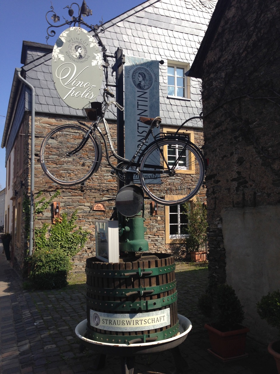 Picture bike at vineyard atop wine press